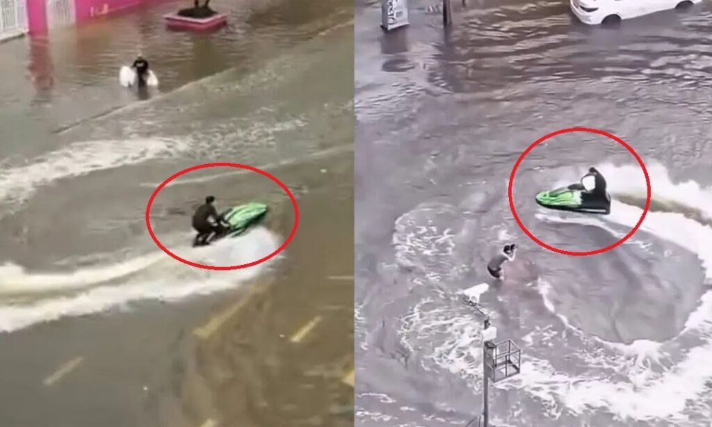 泰国曼谷遭遇严重洪涝,一名男子在积水街道骑乘水上摩托被警方逮